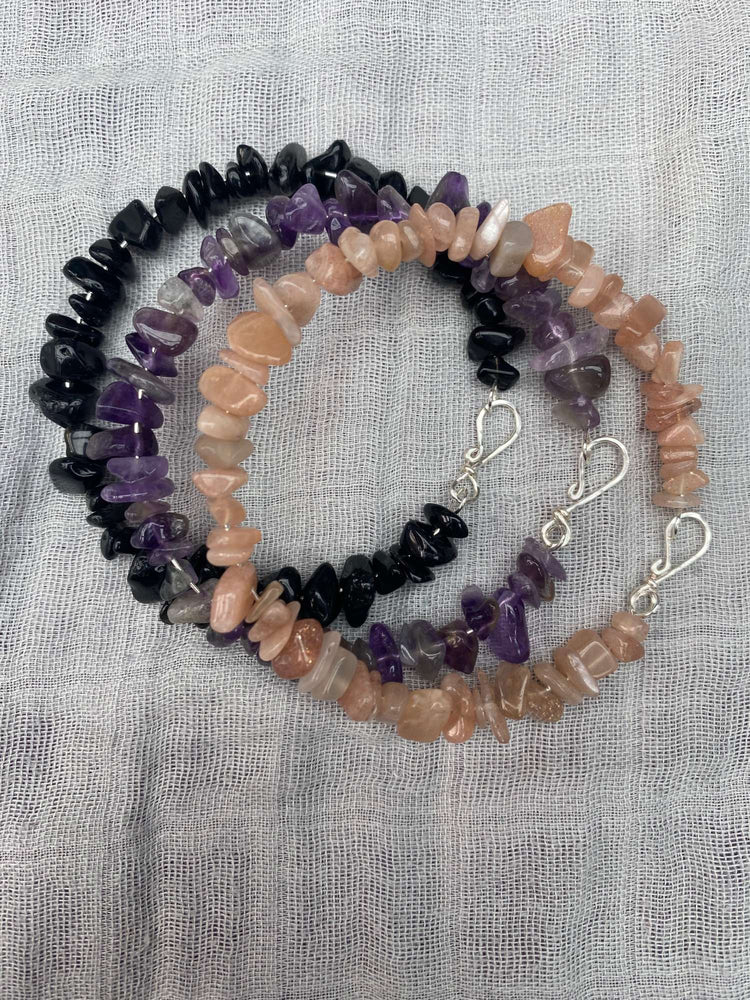 three memory wire bracelets with handmade clasps in sunstone amethyst and black obsidian made with chip beads