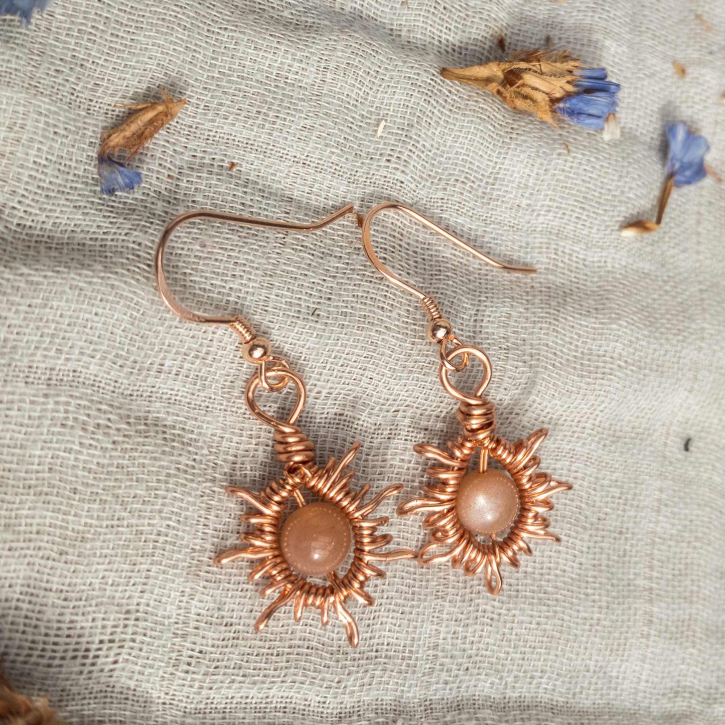 sunburst wire woven wrapped earrings with sunstone beads 