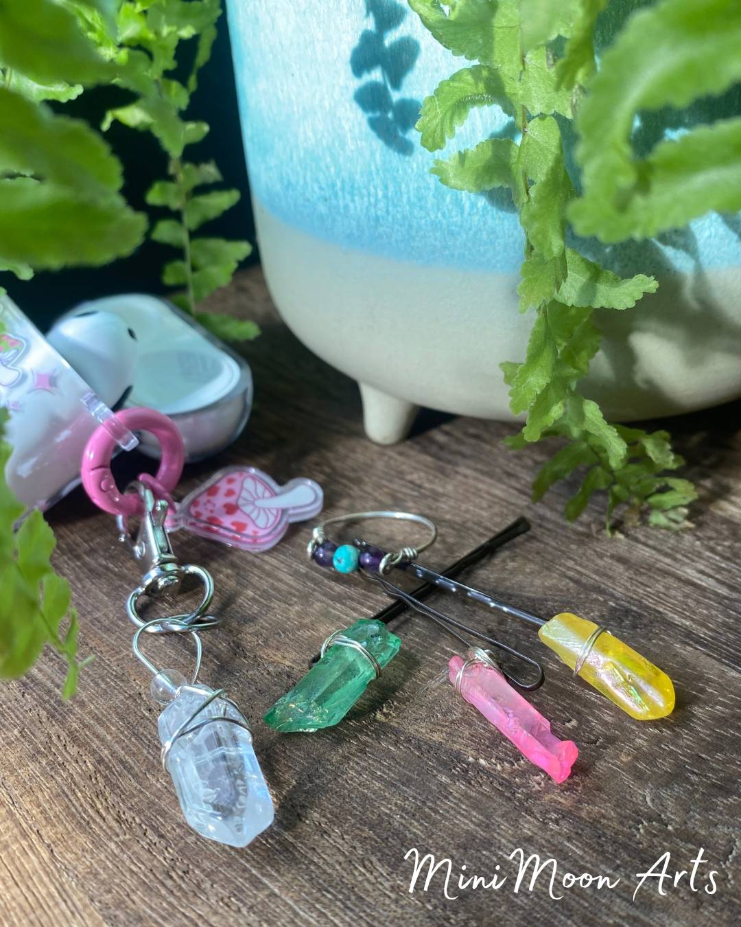 display pic of aura quartz crystal fidget keyring and coloured crystal hair pins and triple fidget ring with amethyst and African turquoise 