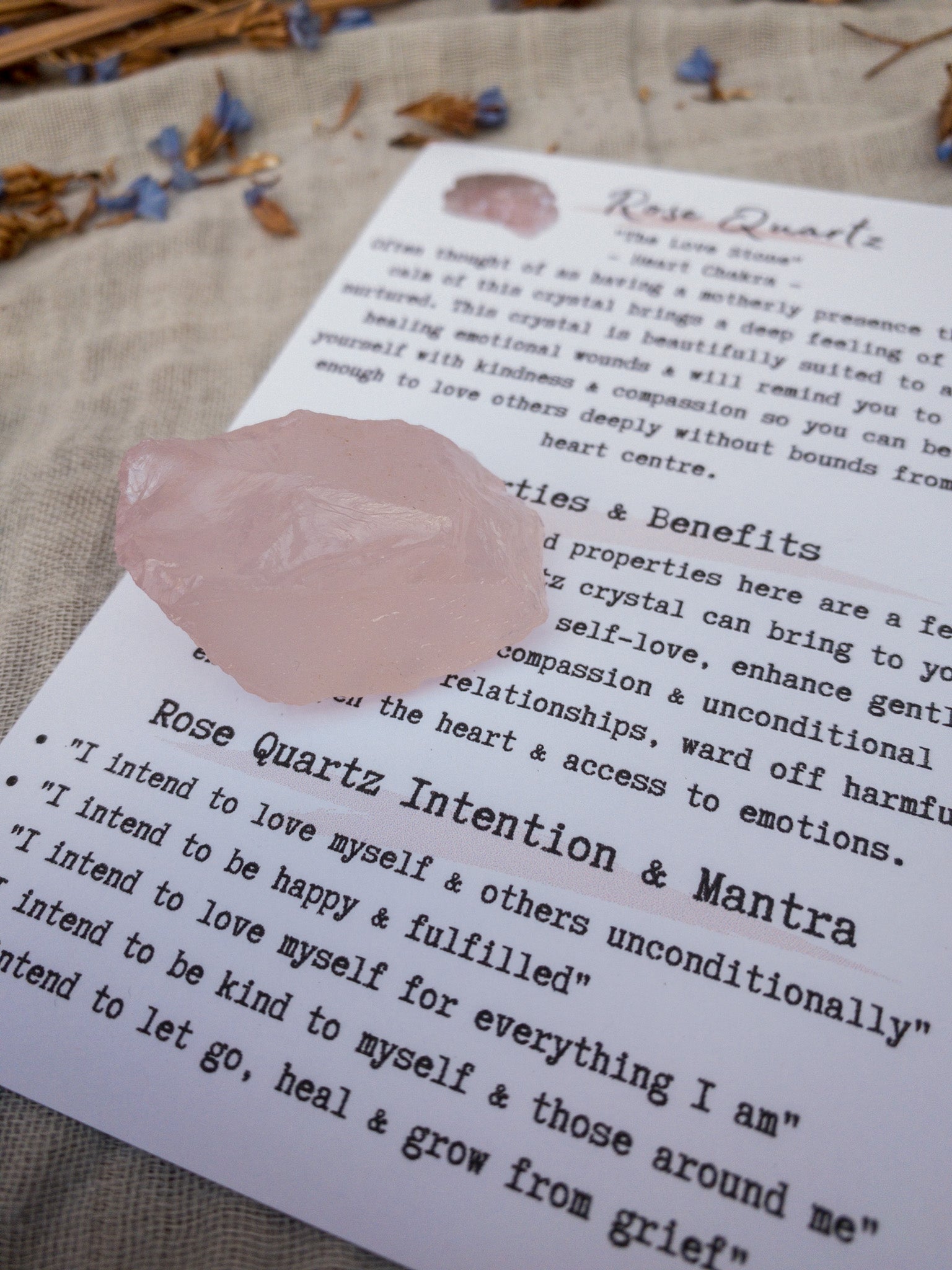 Raw rose quartz chunks with info card