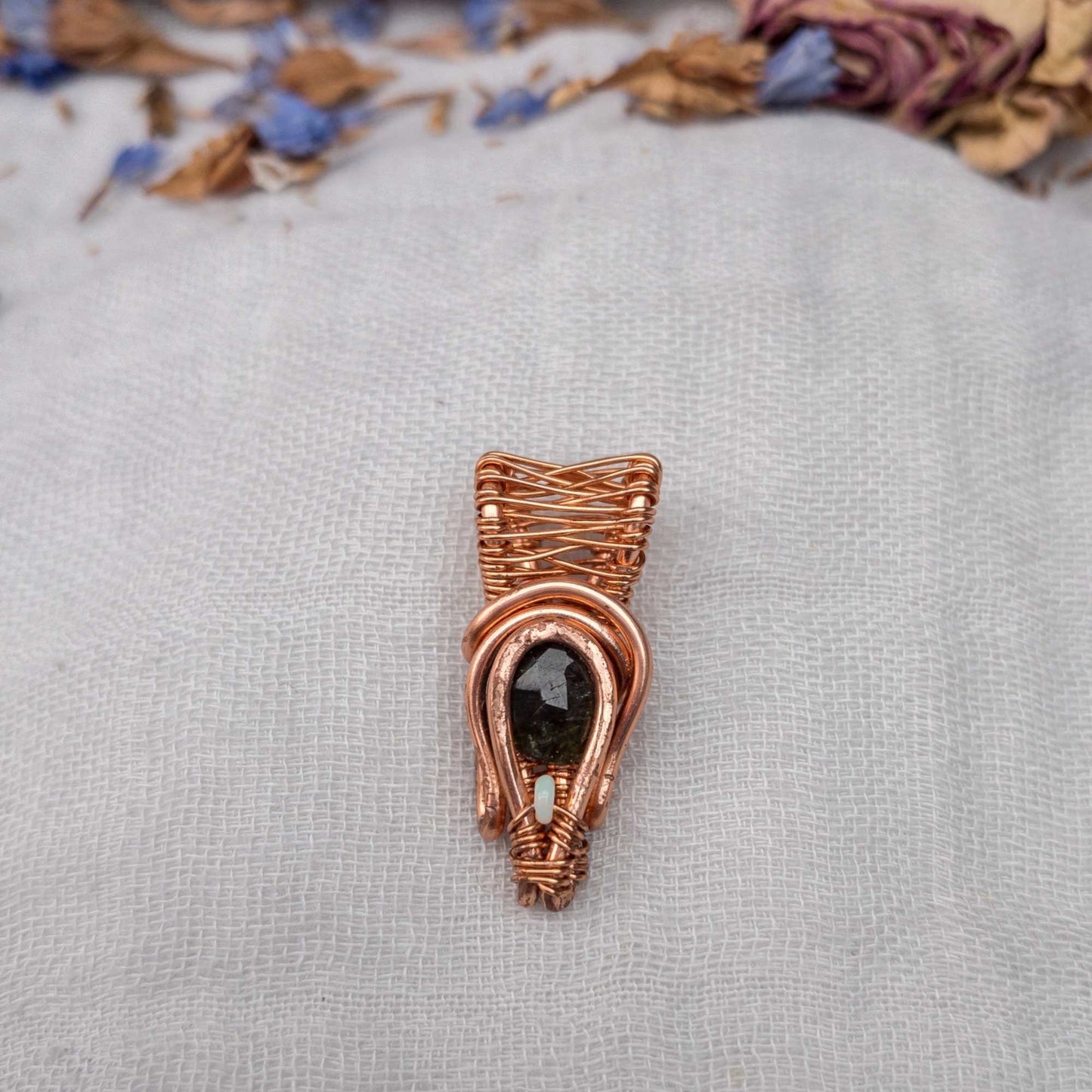 deep green tourmaline and opal wire wrapped pendant in copper wire