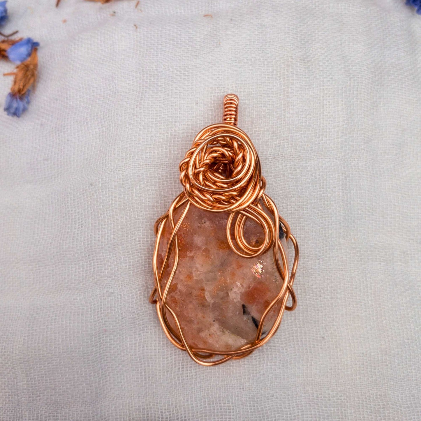 large sunstone wire wrapped in copper wire with rose wrap decal