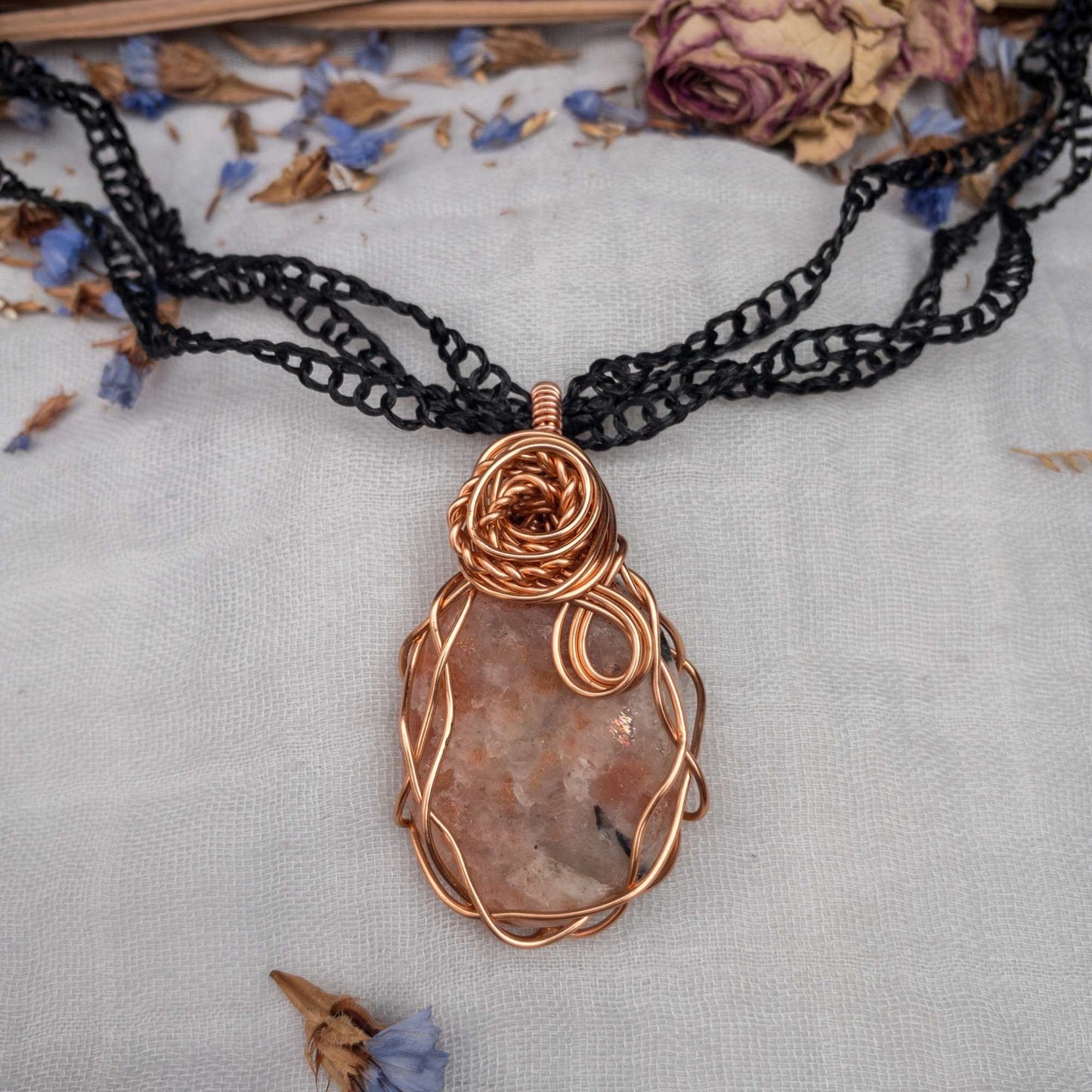 large sunstone wire wrapped in copper wire with rose wrap decal with three stranded vegan silk yarn chain
